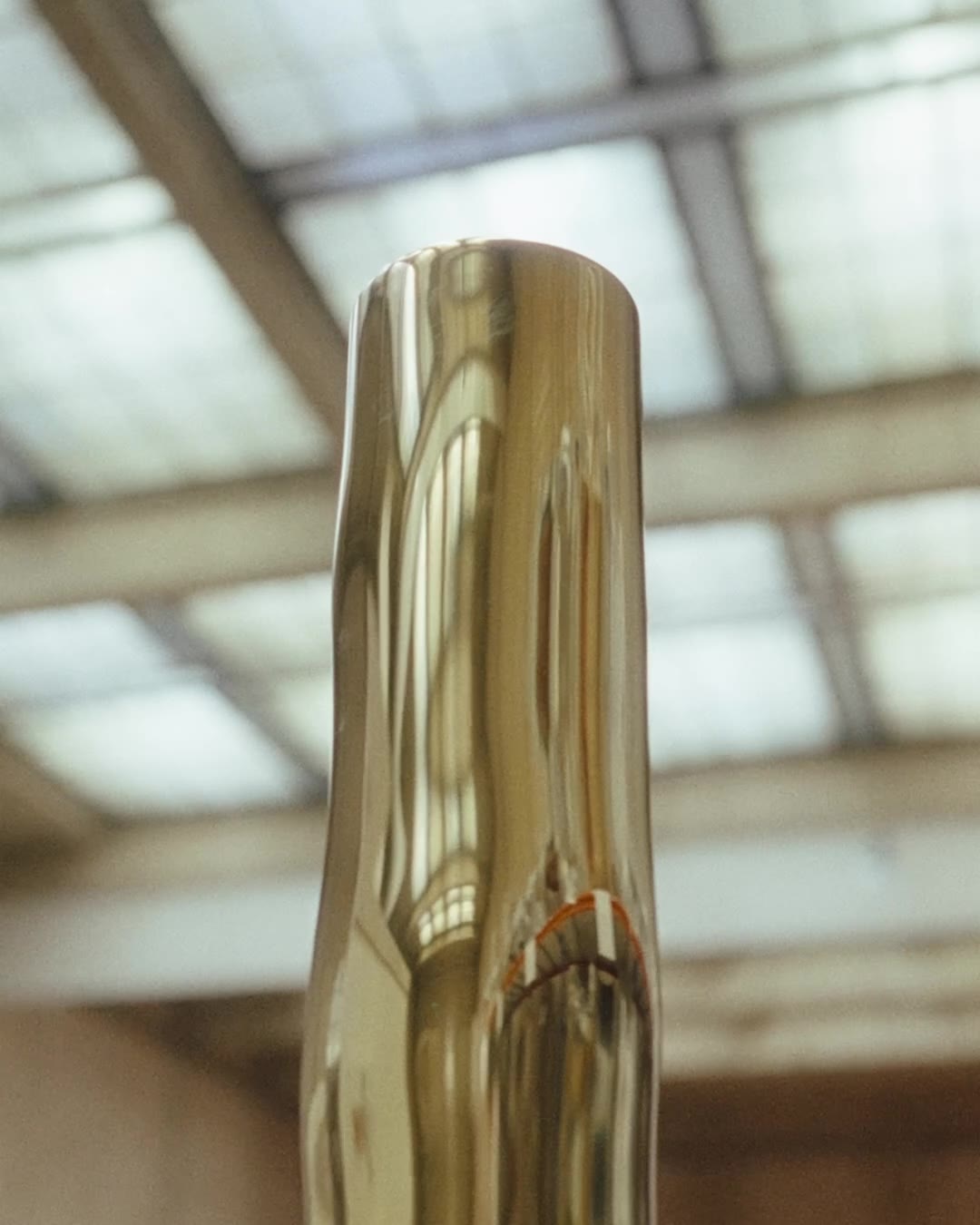 A brass column under the skylights of the Mobilier national