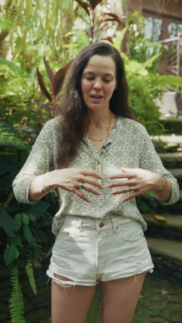 A birth worker speaking in a lush garden