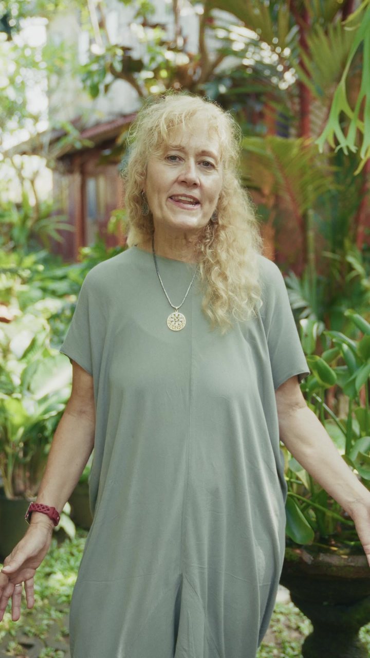 A woman with long blond hair in the garden