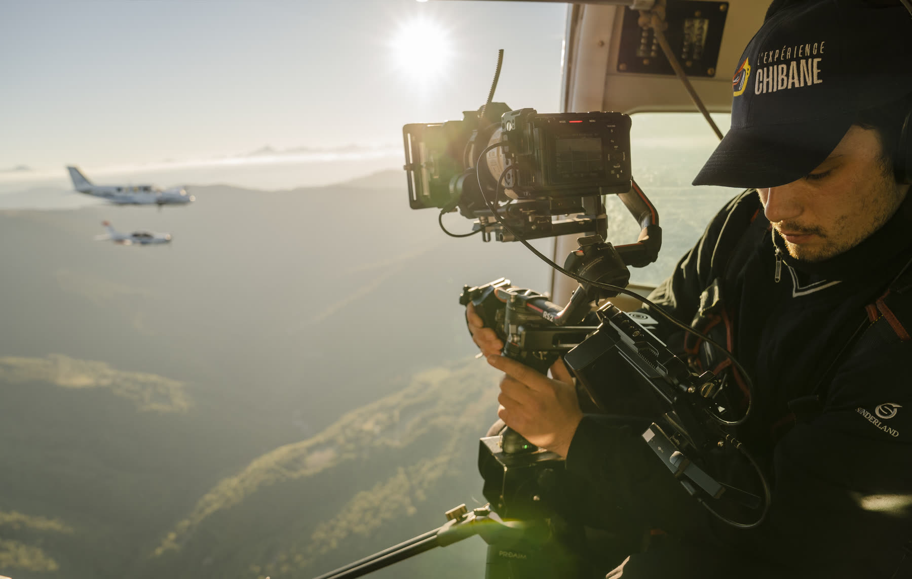 Ilia Gerber filming air to air from an open aircraft door
