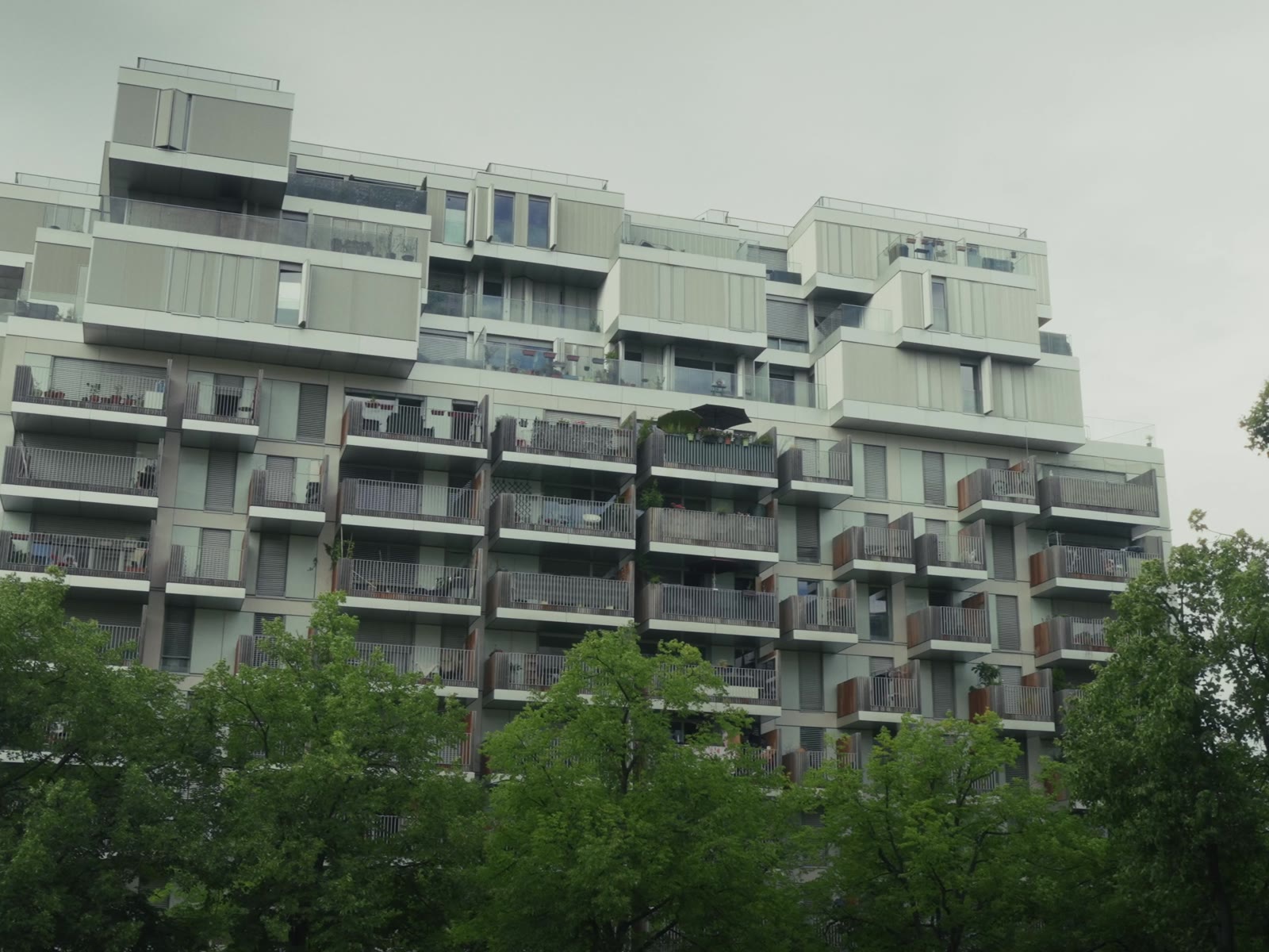 The rebuilt housing above the trees