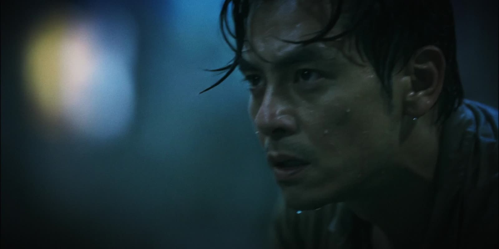 A man sweating in the half-light
